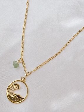 Gold Wave Pendant Necklace with Light Green Accent